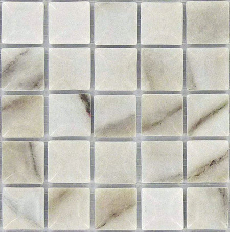 Vidrepur Edna Calacatta BR 1x1 marble pool tiles with elegant veining pattern for luxury contractor installations
